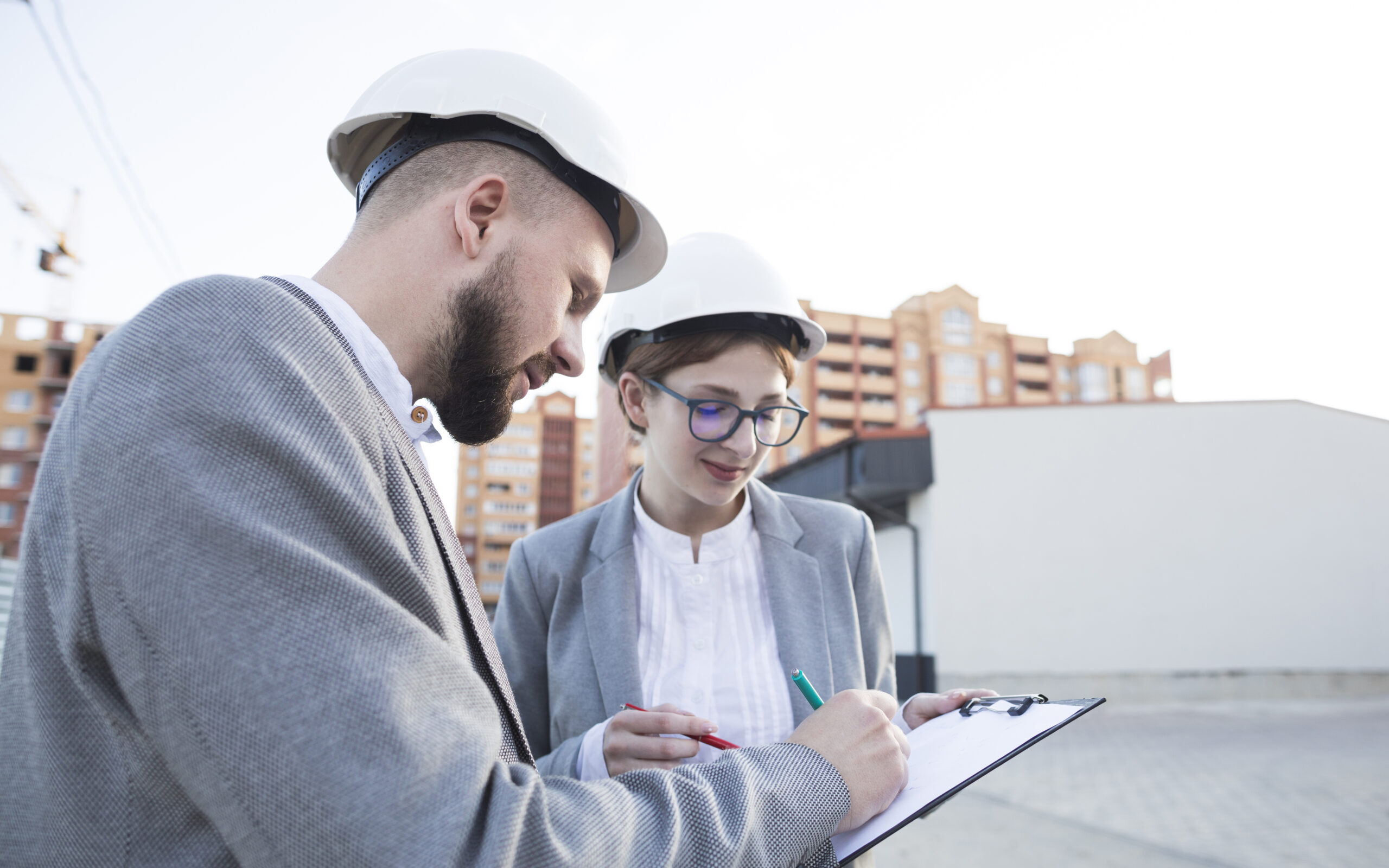 close-up-two-architect-working-together-construction-site
