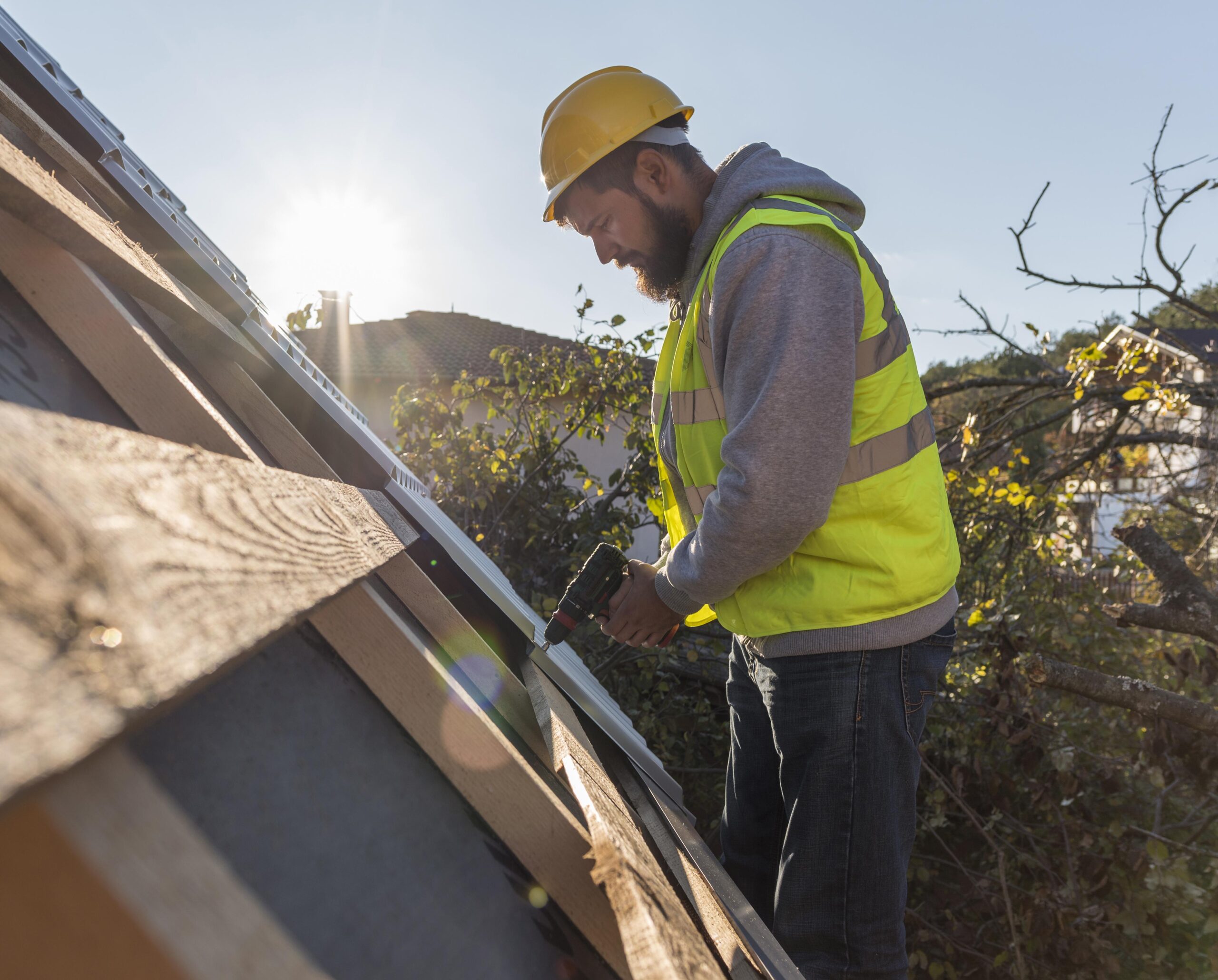 man-working-roof-with-drill